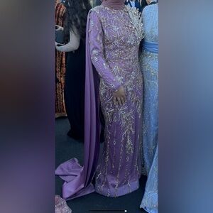 Custom made heavily beaded purple evening gown from Ari & Art